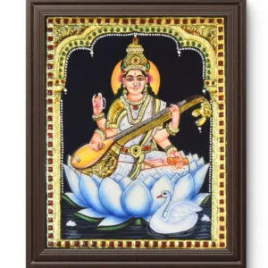 Saraswathi Devi seated on white lotus holding veena, Hindu goddess of knowledge, music, art and wisdom