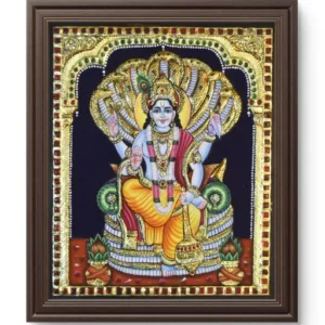 Lord Vishnu with conch, discus, mace and lotus, Hindu preserver god of the universe.