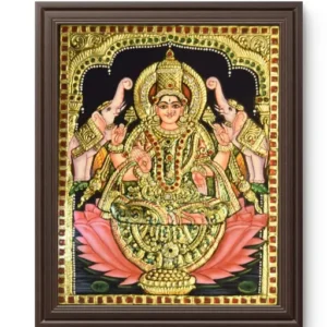 Gajalakshmi seated on lotus flanked by elephants pouring water, Hindu goddess of wealth and prosperity.
